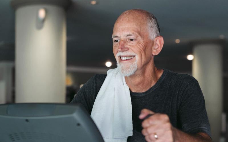 a man working out on an elliptical