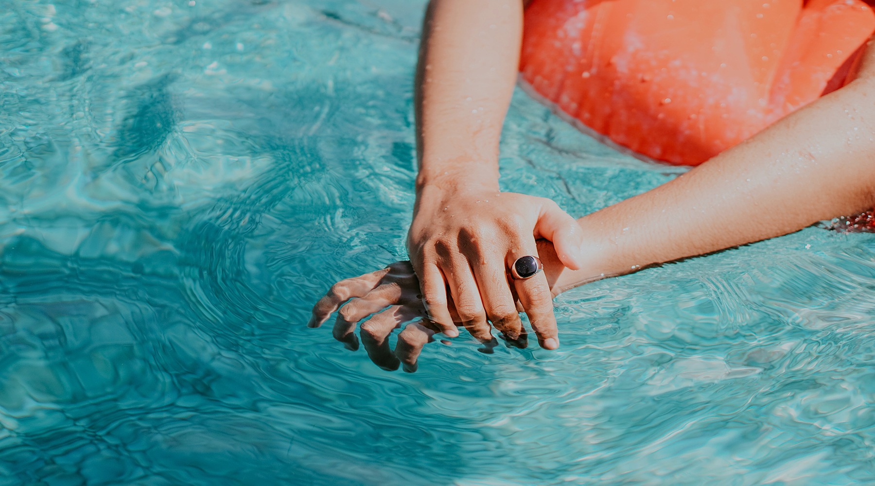 hands in a pool