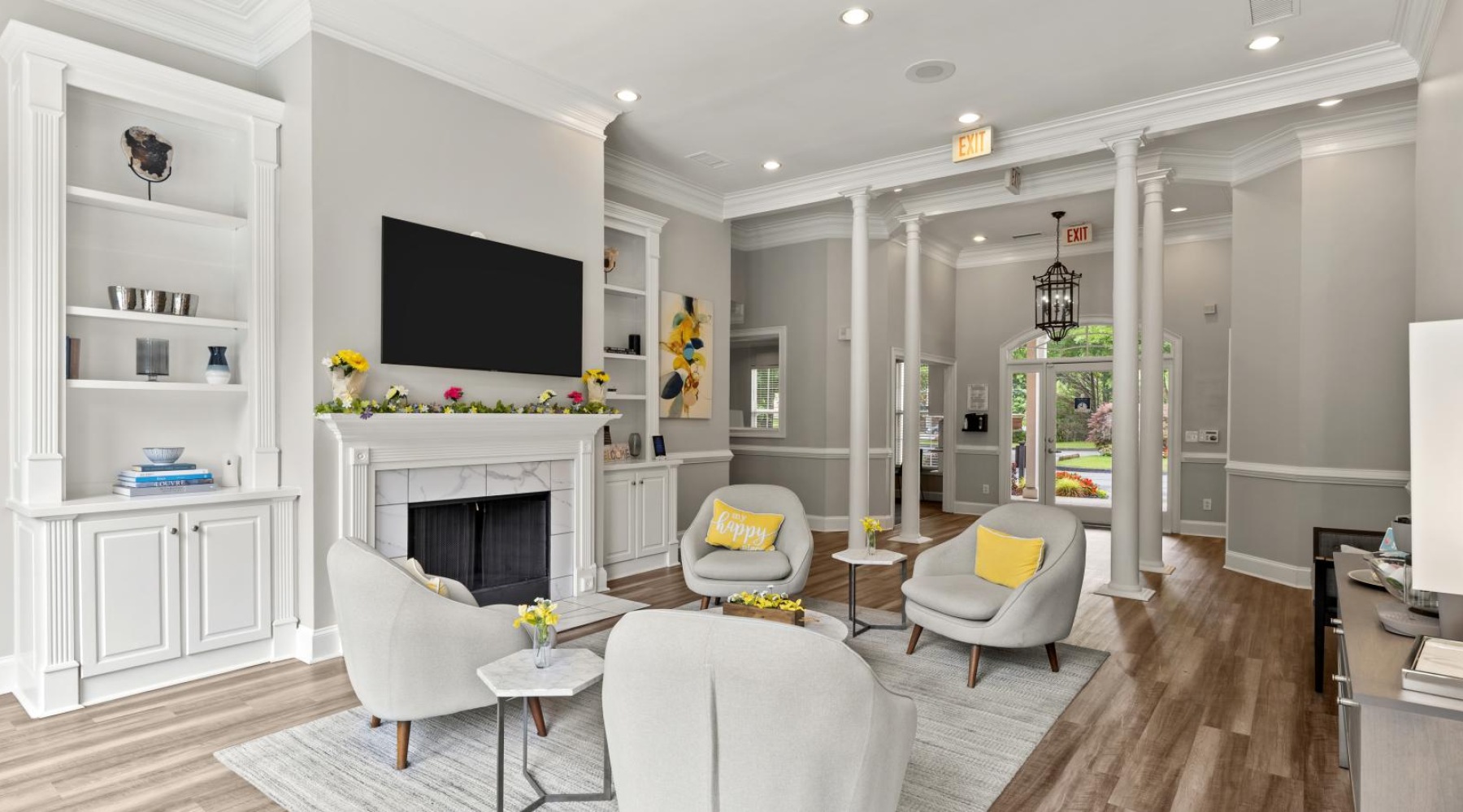 lounge room with wooden flooring and spacious seating spots
