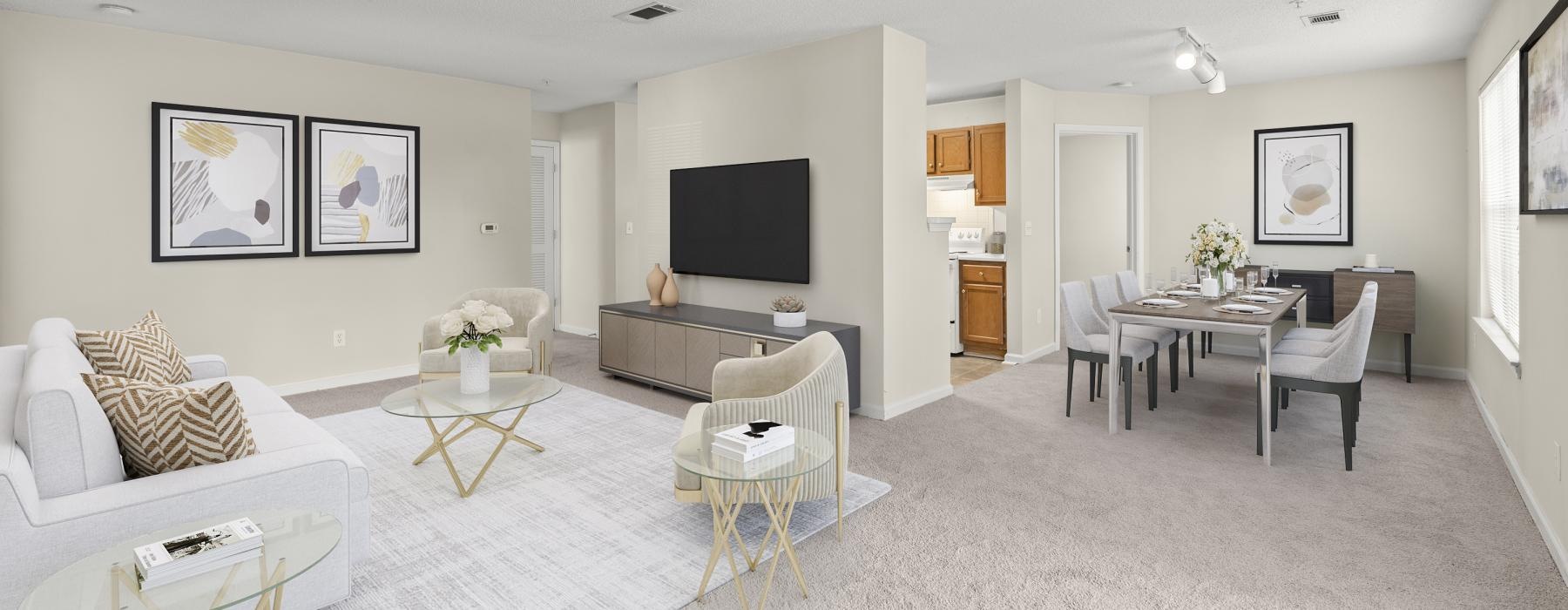 a living room with a white couch and a tv